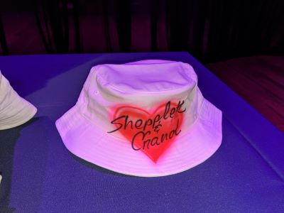 A airbrushed red heart on a bucket hat painted at a bat mitzvah at Armature Works