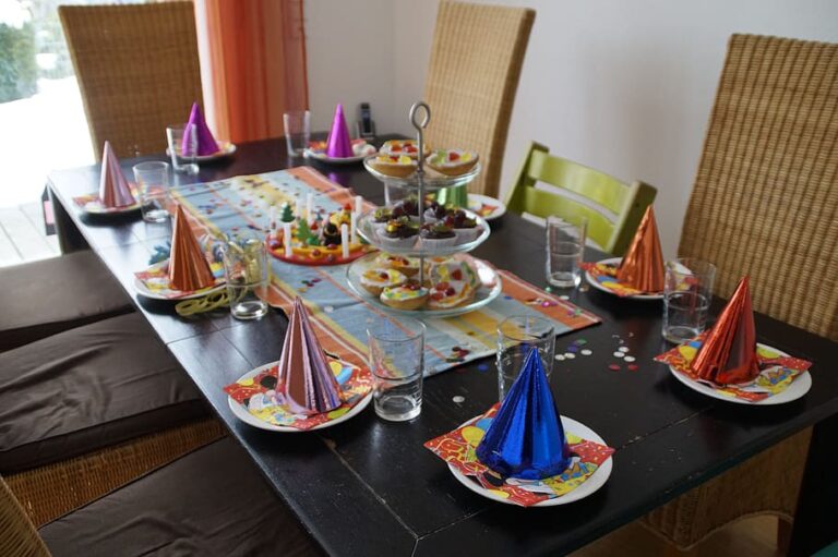 a wooden table decorated for a children's party