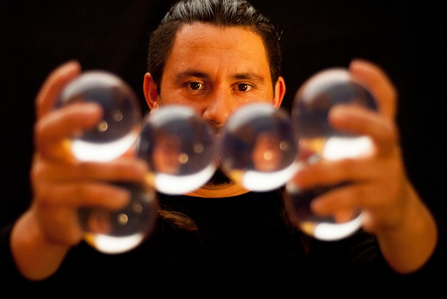 A man juggling glass balls close to the camera- Best Virtual Entertainment Ideas for Your Online Event