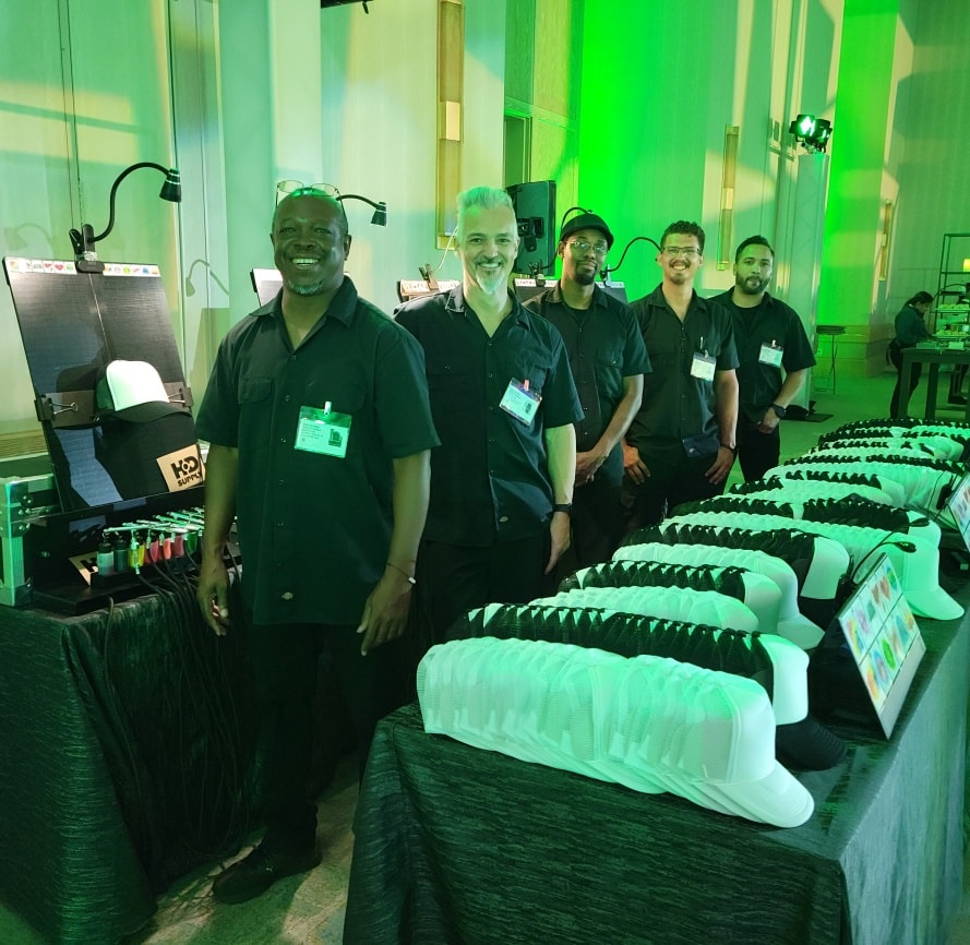 Airbrush artists from Airbrush Events doing all the set up and clean up for airbrush hats for parties.