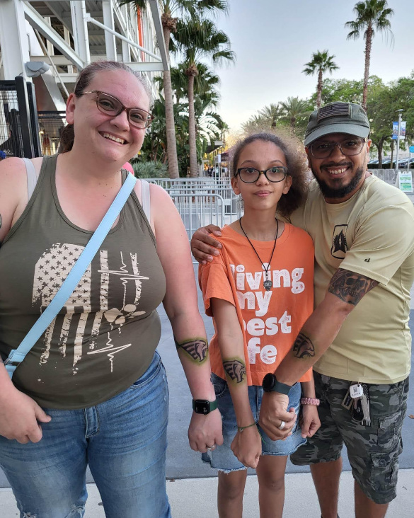 People showing off their airbrush tattoos for parties they got from Airbrush Events.